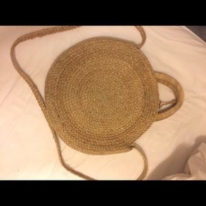 Woven jute circular basket bag with wooden handles